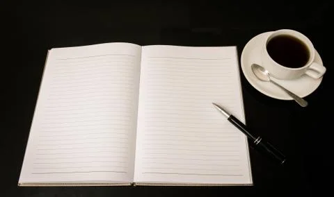 Open a blank white notebook, pen and cup of coffee Stock Photos