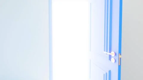 Open blue door showing light emanating from inside room Ilustración de archivo