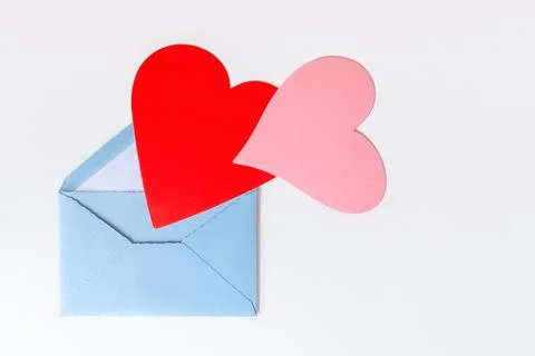 Open blue envelope with two hearts on white background Stock Photos