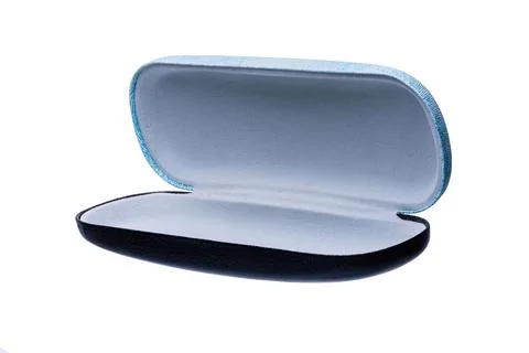 Open blue hard shell eyeglass case on white Фото