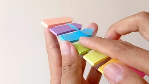 Open up a blue post-it with a white background Stock Footage 145462180