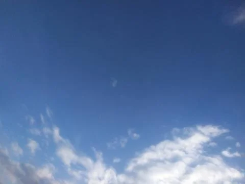Open Blue Sky with Scattered Clouds and Copy Space Stock Photos