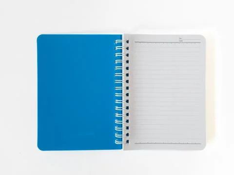 Open Blue Spiral Notebook on White Background Stock Photos