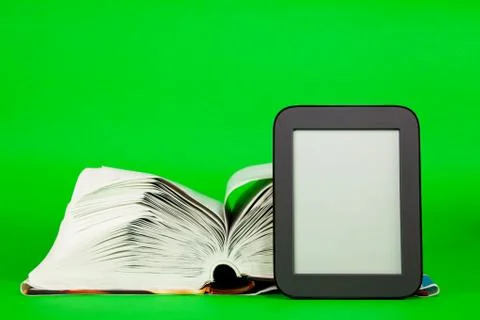 Open book and e-book reader Stock Photos