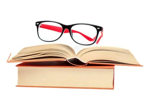 Open book and glasses on a stack of books Stock Photos