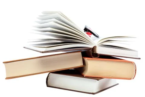 Open book and glasses on a stack of books Stock Photos