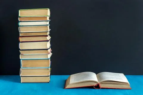 Open book and stack of books Stock Photos