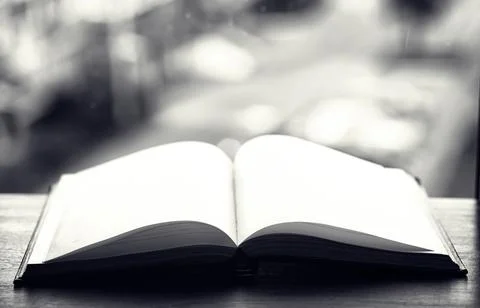 Open book and a table black and white Stock Photos
