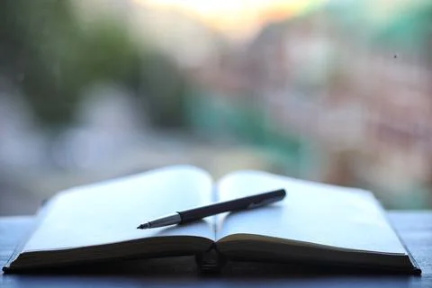 Open book and a table Stock Photos