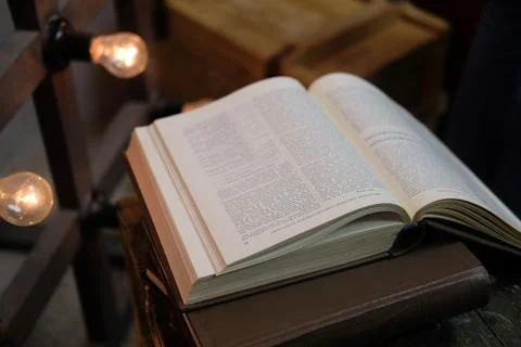 An open book on the background of a box and lap Stock Photos