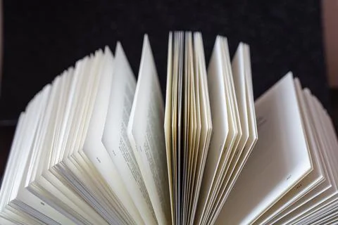 Open book on black background Stock Photos