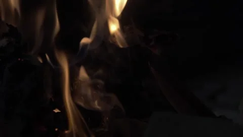 An open book burning in a fire of dry vets at night in an ancient building in Stock Footage 277320512