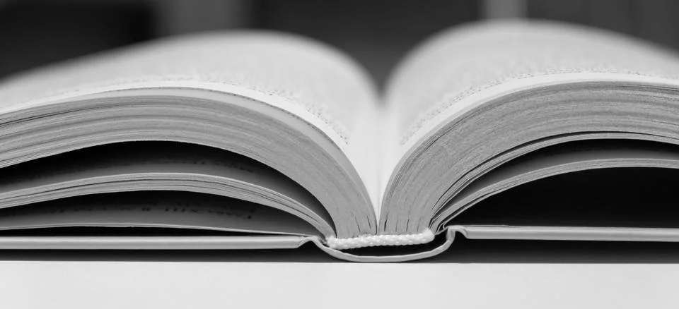 Open book close up. One book is yellow. Stock Photos