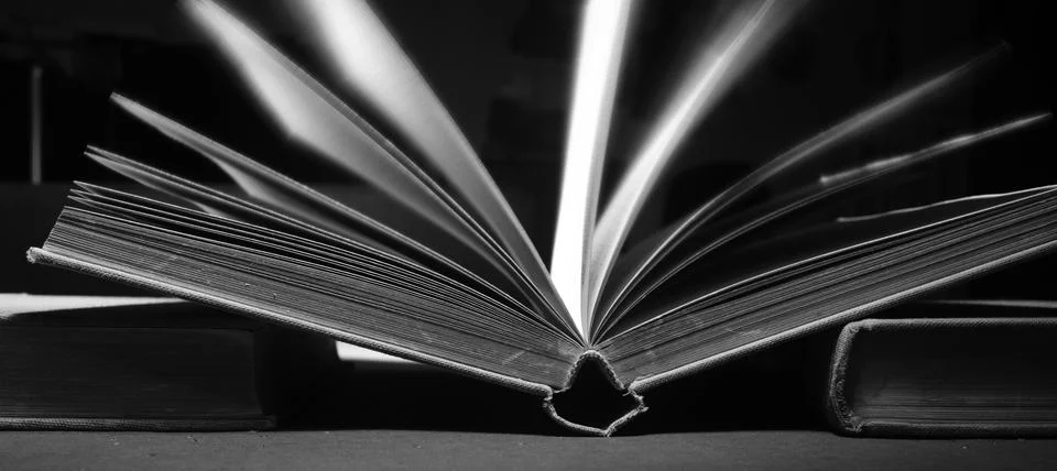 Open book close up,selective focus,black and white, home office,knowledge Stock Photos