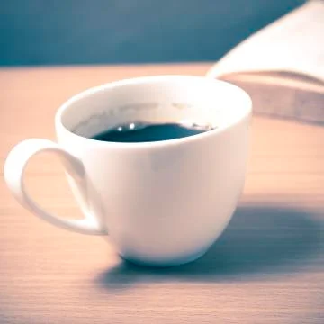 Open book with coffee Stock Photos