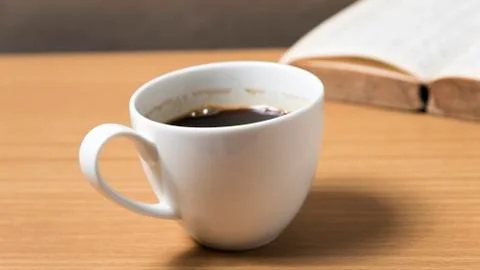 Open book with coffee Stock Photos