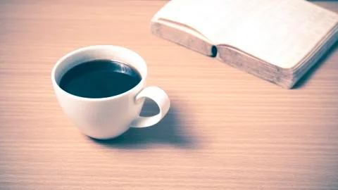 Open book with coffee Stock Photos