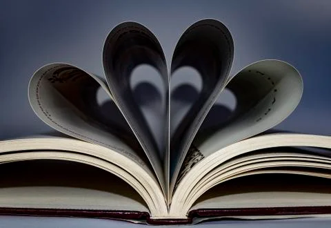 Open book creating shapes with sheets. Stock Photos