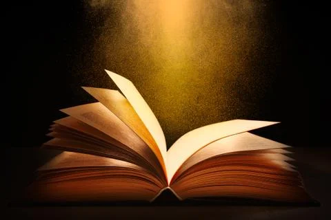 Open book on a dark background Stock Photos