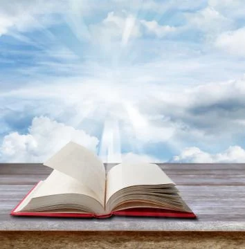Open book on deck in front of sky Stock Photos