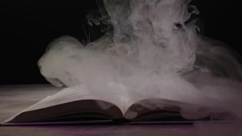 Open Book Enveloped By Magical Smoke With Mysterious Purple Glow Video stock 329837138