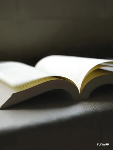 An open book falls into the wind Stock Footage 319311230