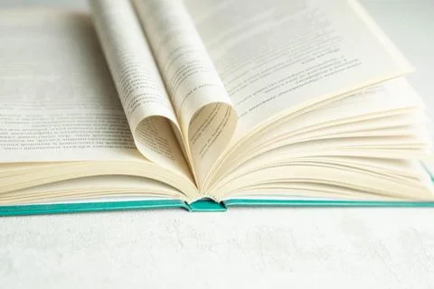 An open book with folded pages in the shape of a heart Stock Photos