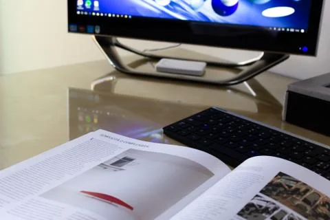 Open book in front of the computer for an e-learning session Stock Photos