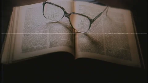 Open Book Glasses Intellectual Concept Old VHS Texture Tracking Shot Video stock 267090453