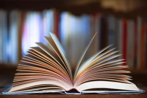 Open book with library background in the library Stock Photos