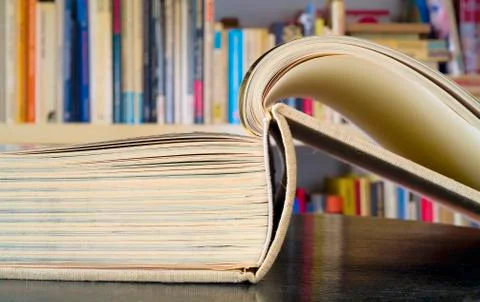 Open book in a library, reading learning,education concept, close up Stock Photos