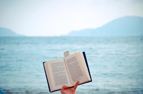 Open book on a mediterranean beach Stock Photos