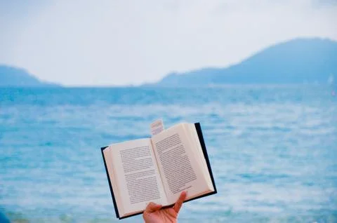 Open book on a mediterranean beach Stock Photos