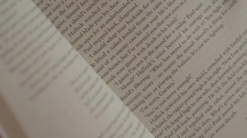 Open Book Pages With Printed Text in Soft Light Video stock 336473312