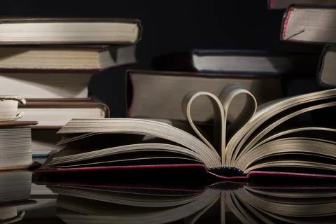 Open Book With Pages In The Shape Of A Heart. Close-up. Stock Photos