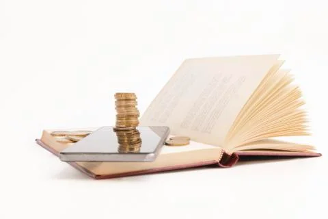 Open book with phone and stack coins Stock Photos