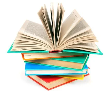 The open book on a pile of multi-coloured books. 스톡 사진