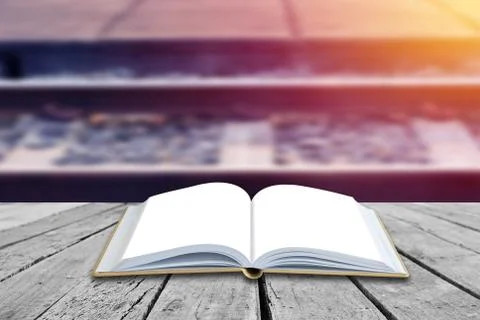 Open book with rail in soft light background Stock Photos