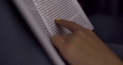 An open book, read the night before bed in the bedroom. Slow motion. Stock Footage 145767196