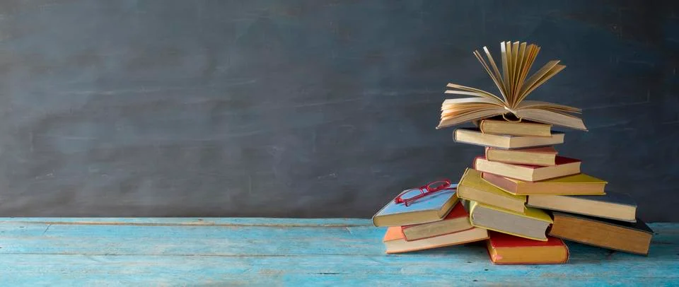 Open book on a stack of books, reading, education, home office concept, Stock Photos