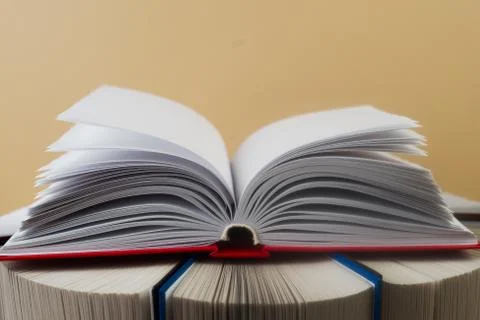 Open book, stack of hardback books. Back to school. Copy space Stock Photos
