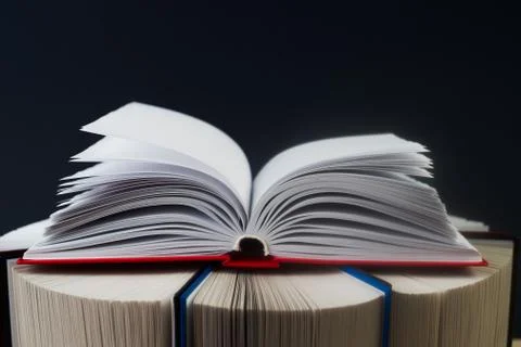 Open book, stack of hardback books. Back to school. Copy space Stock Photos