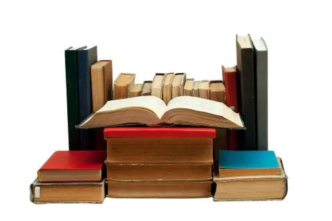 Open book, stack of hardback books isolated. Back to school. Copy space Foto stock