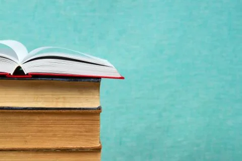 Open book, stack of hardback books. Back to school Stock Photos