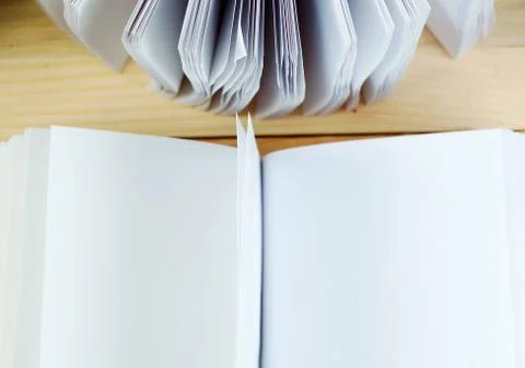 Open book, stack of hardback books on wooden table. Back to school. Copy space Stock Photos
