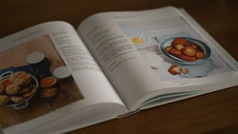 Open Book on a table Stock Footage 263734630