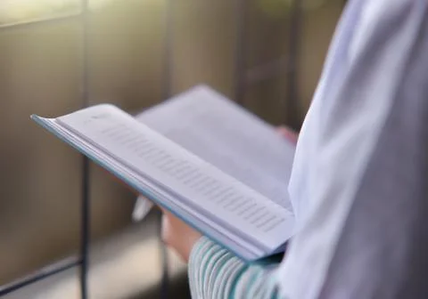 Open book on the table in library Stock Photos