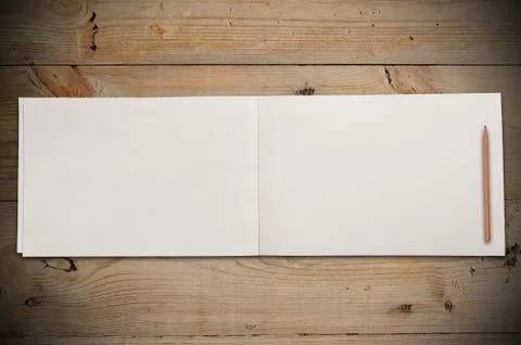 Open book on table Stock Photos