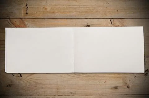 Open book on table Stock Photos