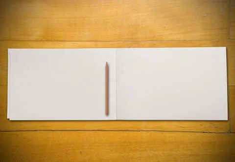 Open book on table Stock Photos